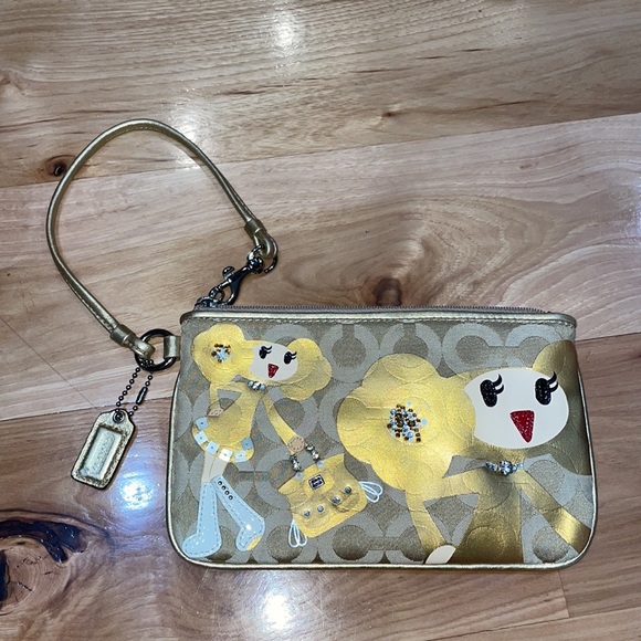 Coach Handbags - Coach RARE Poppy Chan Goldy Wristlet signature CC gold limited edition